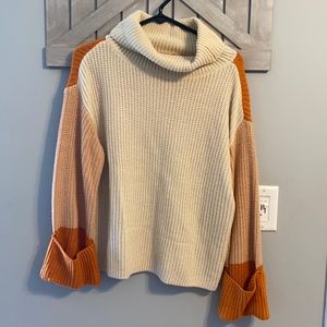 Orange and white turtle neck size small